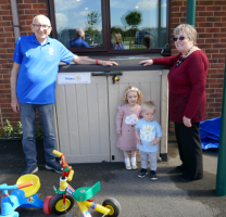 Rayleigh Mill Rotary Community and Vocational Committee Chairman, Bill Farmer and Christine Howard of the Grange Parent and Toddler Group with two of the group’s members 